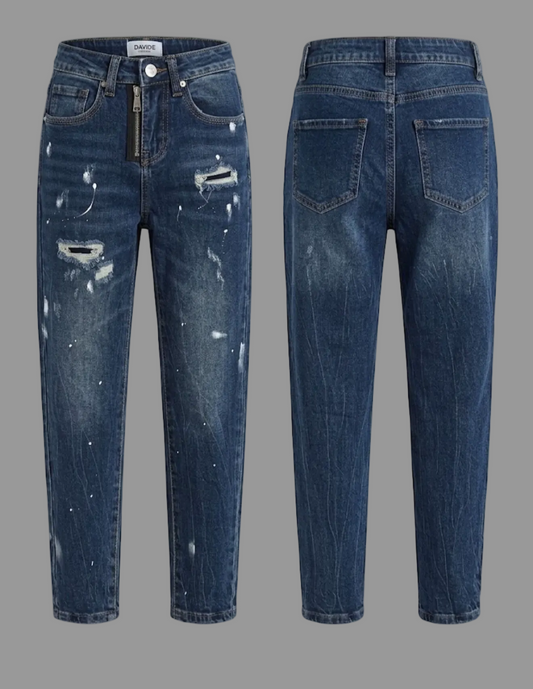 Jeans bambino con strappi e schizzi in bianco